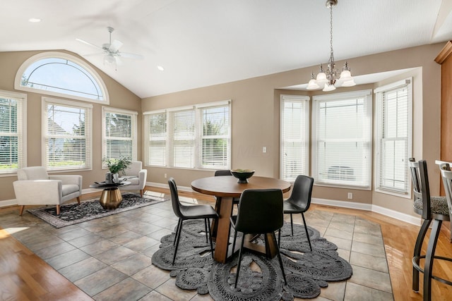 4568 Hickory Rock Dr, Powell, OH 43065 - dining area with lofted ceiling, baseboards, and ceiling fan with notable chandelier