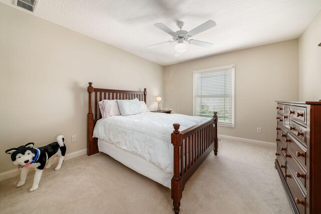 4568 Hickory Rock Dr, Powell, OH 43065 - bedroom featuring baseboards, visible vents, ceiling fan, and light colored carpet