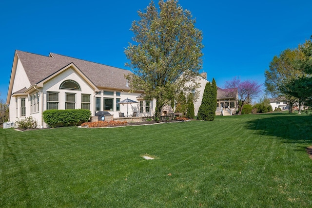 4568 Hickory Rock Dr, Powell, OH 43065 - back of house with a yard and stucco siding