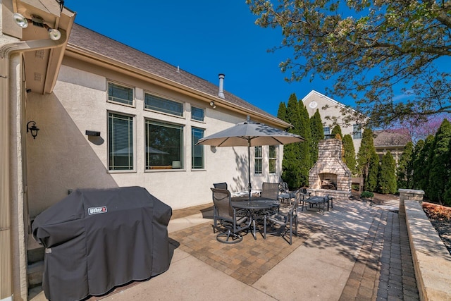4568 Hickory Rock Dr, Powell, OH 43065 - view of patio with a multi sided fireplace and grilling area