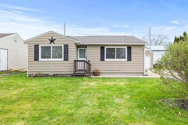 ranch-style home featuring a front yard