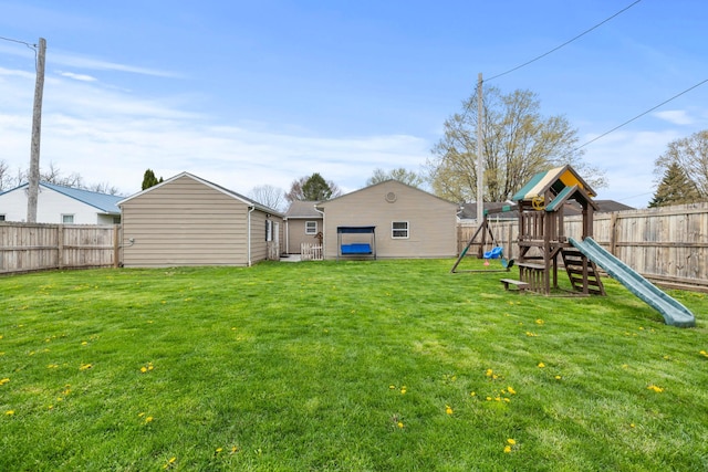view of yard featuring a fenced backyard and a playground
