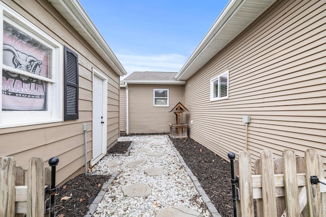 view of side of home with fence