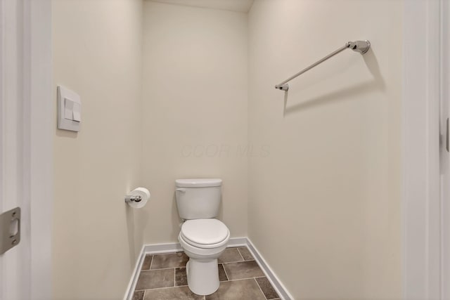 3051 Lamptonridge Dr, Columbus, OH 43232 - bathroom with tile patterned floors, baseboards, and toilet