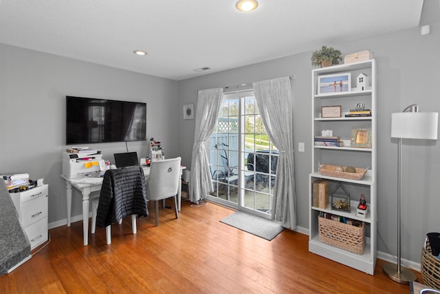 office with recessed lighting, visible vents, baseboards, and wood finished floors