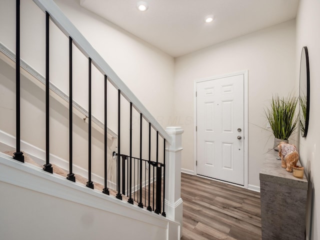9239 Horseshoe St, Plain City, OH 43064 - entryway with baseboards, stairway, wood finished floors, and recessed lighting