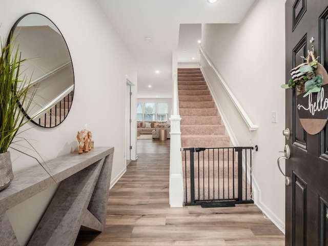 9239 Horseshoe St, Plain City, OH 43064 - foyer with stairs, light wood-style floors, baseboards, and recessed lighting