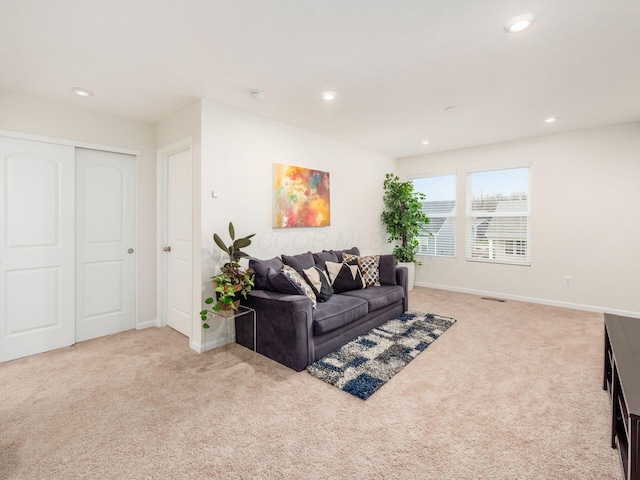9239 Horseshoe St, Plain City, OH 43064 - carpeted living room with baseboards, visible vents, and recessed lighting