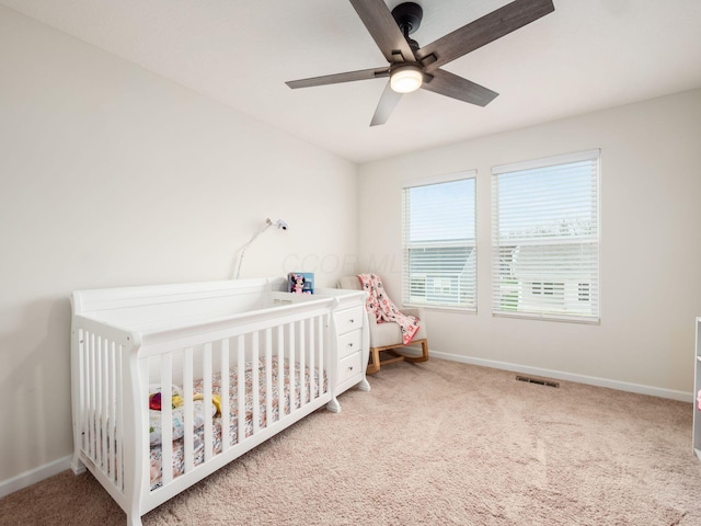 9239 Horseshoe St, Plain City, OH 43064 - bedroom with a crib, carpet floors, baseboards, and visible vents