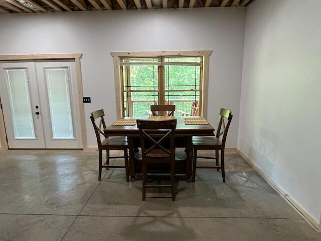 670 Natchez Ln, Sugar Grove, OH 43155 - dining space featuring french doors and concrete floors