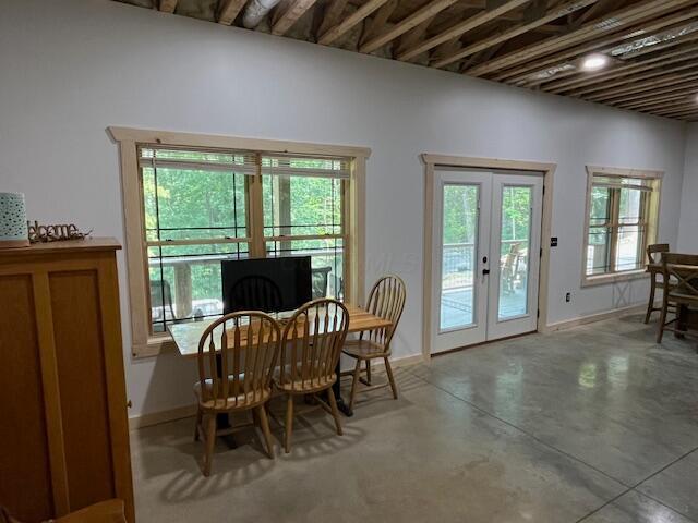 670 Natchez Ln, Sugar Grove, OH 43155 - dining room featuring french doors and concrete flooring