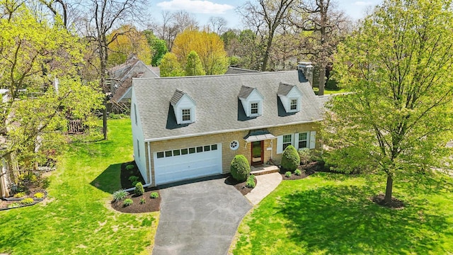 1800 Timberline Dr, Springfield, OH 45504 - new england style home with aphalt driveway, a chimney, a garage, a front lawn, and a shingled roof