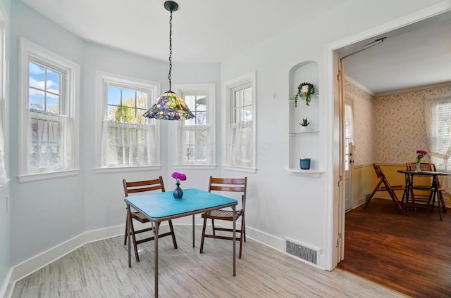 1800 Timberline Dr, Springfield, OH 45504 - dining space featuring baseboards, visible vents, plenty of natural light, and wood finished floors