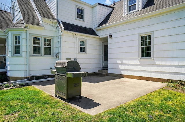 1800 Timberline Dr, Springfield, OH 45504 - exterior space featuring a lawn, a patio, a shingled roof, and entry steps