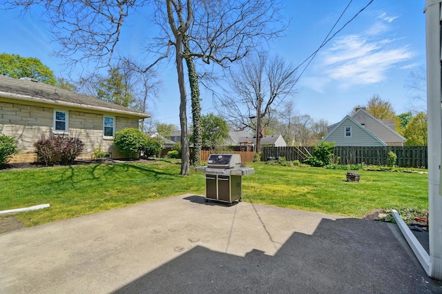 1800 Timberline Dr, Springfield, OH 45504 - view of patio with a fenced backyard, a fire pit, and a grill