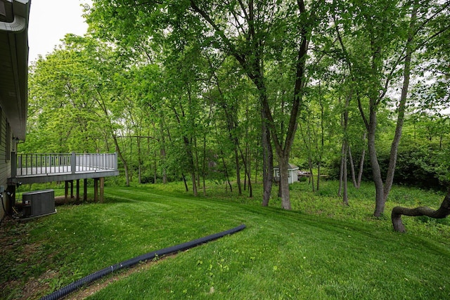 3040 Lafayette Plain City Rd, London, OH 43140 - view of grassy yard with cooling unit and a wooden deck