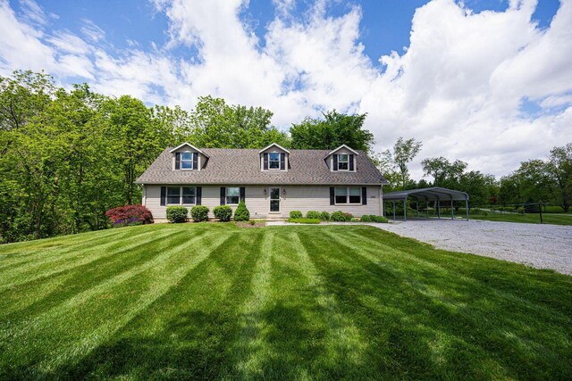 3040 Lafayette Plain City Rd, London, OH 43140 - new england style home with driveway, a carport, and a front lawn