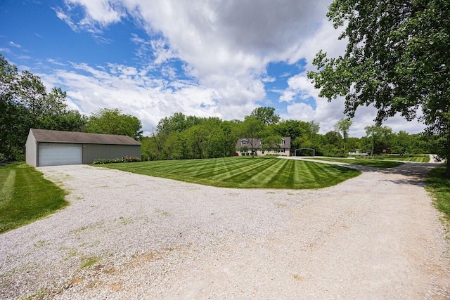 3040 Lafayette Plain City Rd, London, OH 43140 - view of front of home featuring an outdoor structure, a front yard, and a garage