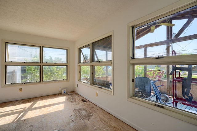 1473 Venice Dr, Columbus, OH 43207 - sunroom featuring baseboards, a textured ceiling, and visible vents