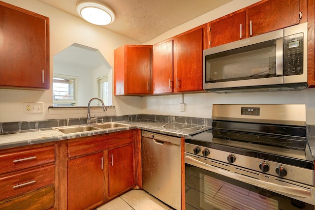 1473 Venice Dr, Columbus, OH 43207 - kitchen featuring stainless steel appliances, a sink, and light tile patterned floors