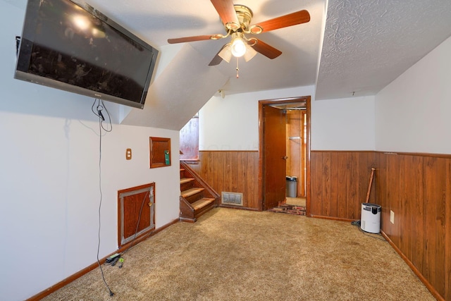 1473 Venice Dr, Columbus, OH 43207 - additional living space featuring wooden walls, carpet floors, wainscoting, stairs, and ceiling fan