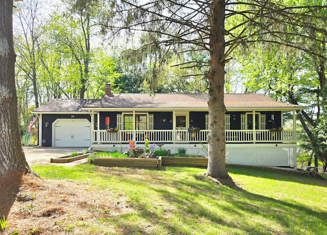 ranch-style home featuring a chimney, a porch, driveway, a front yard, and an attached garage