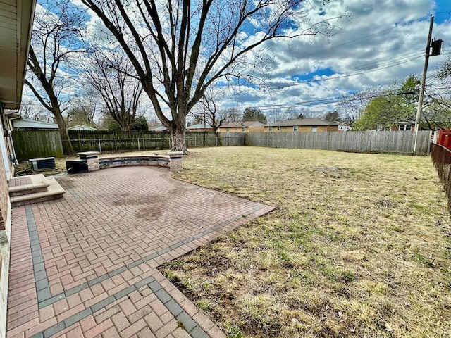view of yard with a fenced backyard and a patio