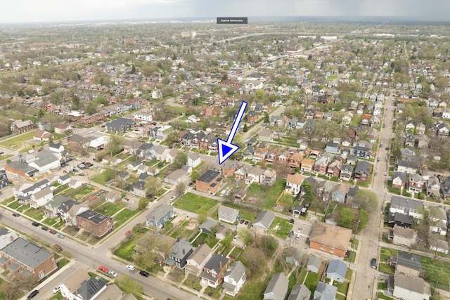birds eye view of property with a residential view