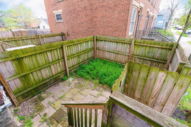 view of yard with fence and a patio