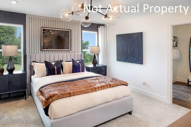 6326 Anguria Dr Lot 244, Hilliard, OH 43026 - bedroom with baseboards and a chandelier