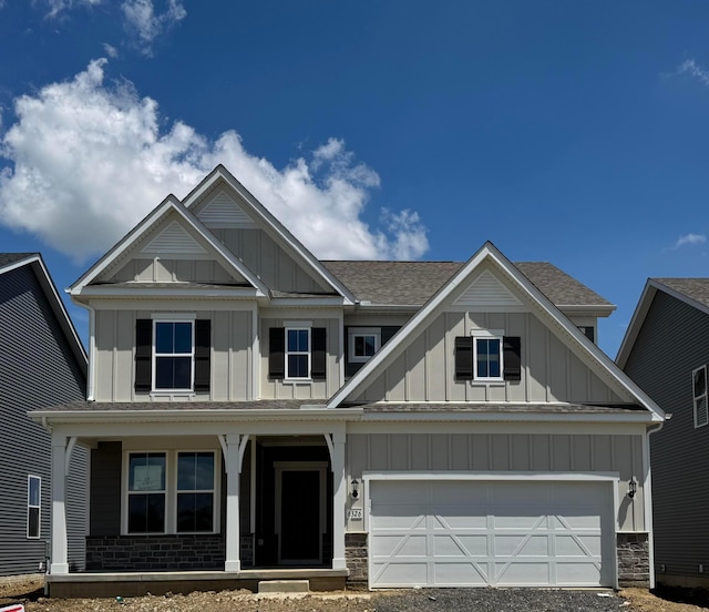 6326 Anguria Dr Lot 244, Hilliard, OH 43026 - craftsman-style house featuring board and batten siding, covered porch, a garage, and roof with shingles