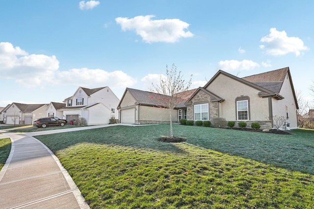 view of front of property featuring stone siding, a garage, concrete driveway, a front lawn, and stucco siding