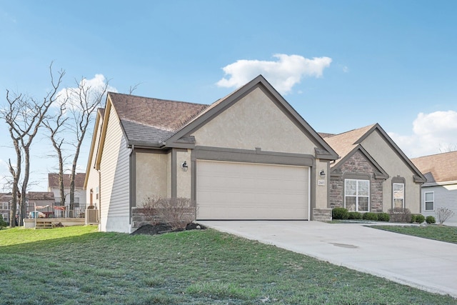 view of front of property featuring stone siding, an attached garage, concrete driveway, a front yard, and stucco siding