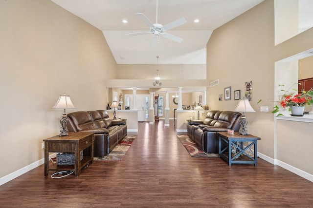 living area with recessed lighting, high vaulted ceiling, baseboards, ceiling fan, and wood finished floors