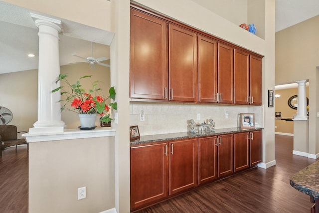 kitchen featuring a ceiling fan, backsplash, and ornate columns