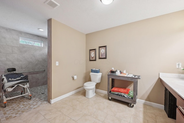 full bath with visible vents, walk in shower, baseboards, toilet, and vanity
