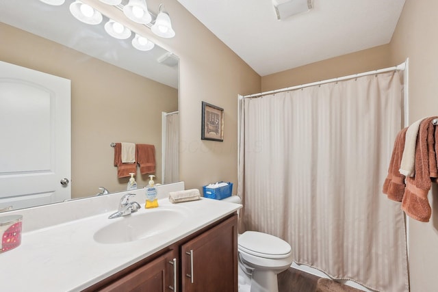 full bathroom featuring visible vents, toilet, and vanity