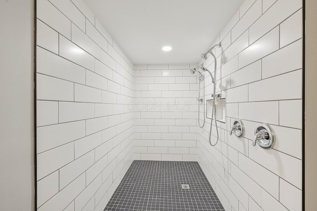 full bathroom with tiled shower