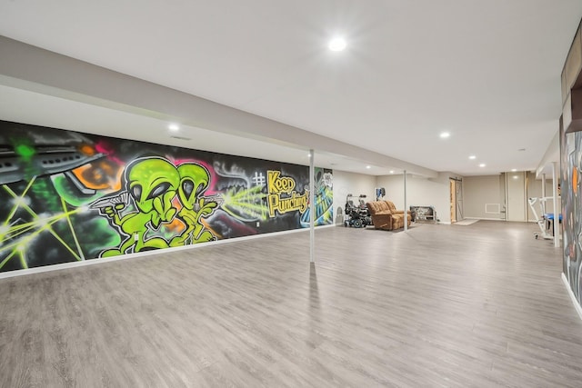 finished basement with wood finished floors and recessed lighting