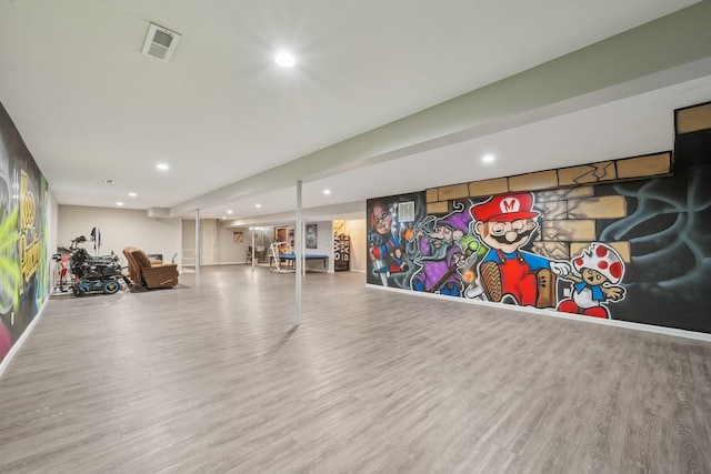 exercise area featuring visible vents, recessed lighting, and wood finished floors