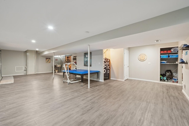 recreation room featuring baseboards, visible vents, wood finished floors, and recessed lighting
