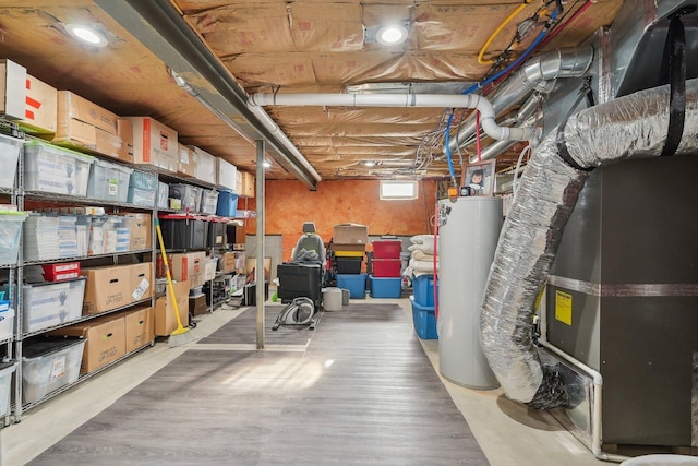 basement featuring heating unit and gas water heater