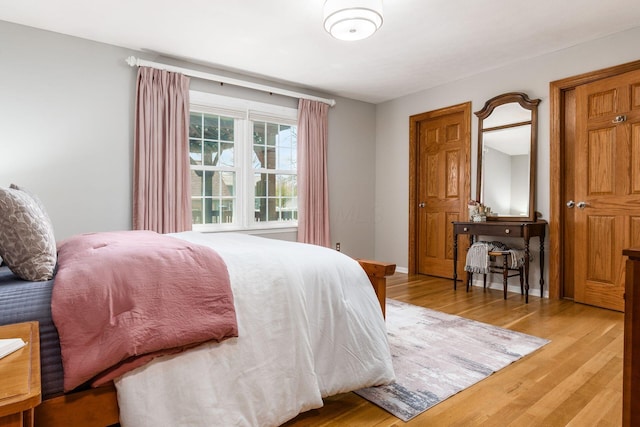 bedroom with light wood-type flooring