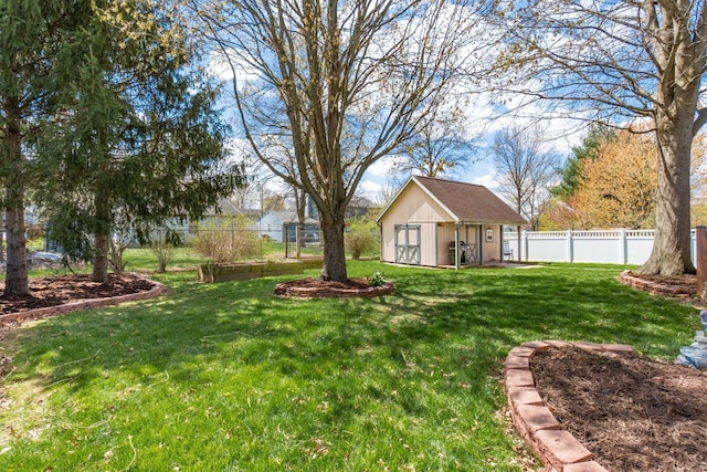 view of yard with an outbuilding, a shed, and fence