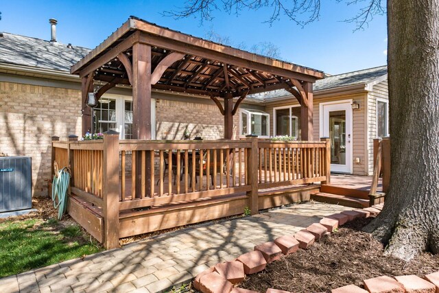 deck featuring central AC and a gazebo