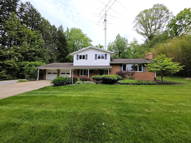 5344 Ridge Ave SE, Canton, OH 44707 - tri-level home with an attached garage, a front yard, driveway, and a chimney