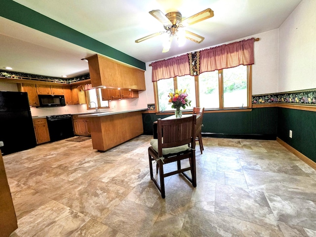 5344 Ridge Ave SE, Canton, OH 44707 - kitchen with black appliances, a peninsula, brown cabinets, ceiling fan, and a sink