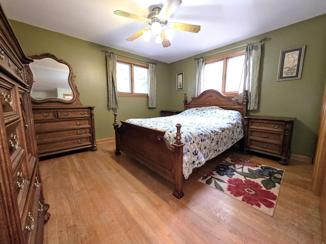 5344 Ridge Ave SE, Canton, OH 44707 - bedroom with light wood-style floors, baseboards, and a ceiling fan