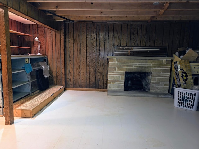 5344 Ridge Ave SE, Canton, OH 44707 - unfurnished living room featuring wood walls, a stone fireplace, and tile patterned floors