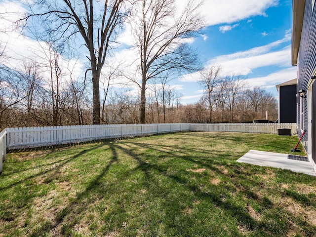 view of yard with a fenced backyard